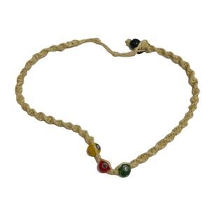 Woven green, red, yellow eye necklace